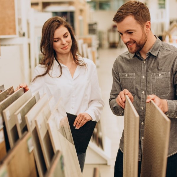 Customer shopping for flooring samples in a showroom