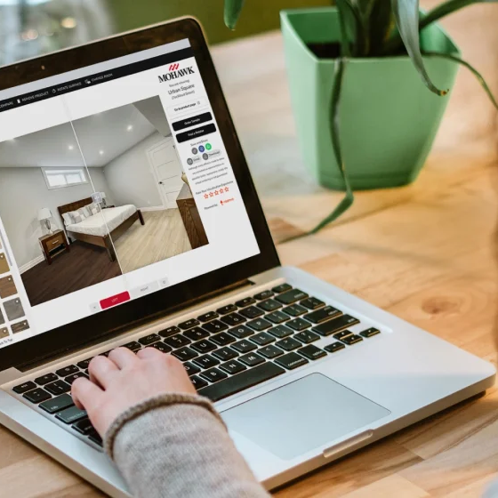 Woman using the state of the art Roomvo room visualizer to complete a flooring project.
