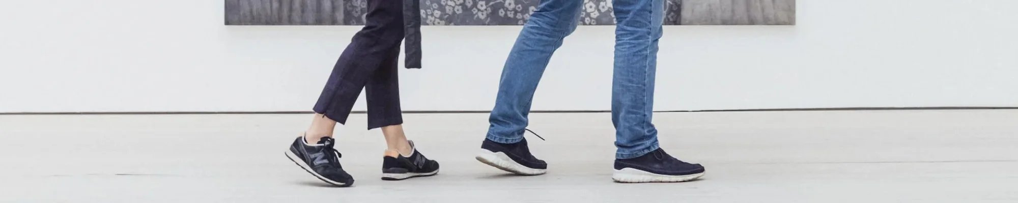 Customers walking across a white floor in a commercial space