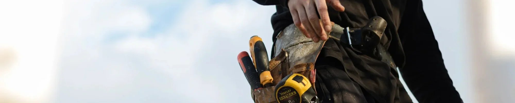 Flooring contractor in New Jersey with a tool belt